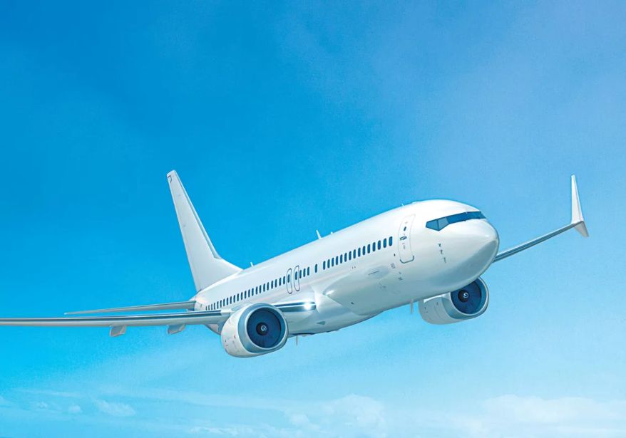 Aerospace engineering technology enables a modern passenger airplane to fly through a clear blue sky.